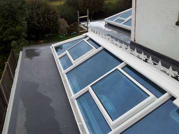 Mr & Mrs K. Irby Wirral : Installtion of 2 no Aluminium - PvcU Clad skylights. Double glazed with Celsius one glass- U value 1. Electric roof vent with rain censors 